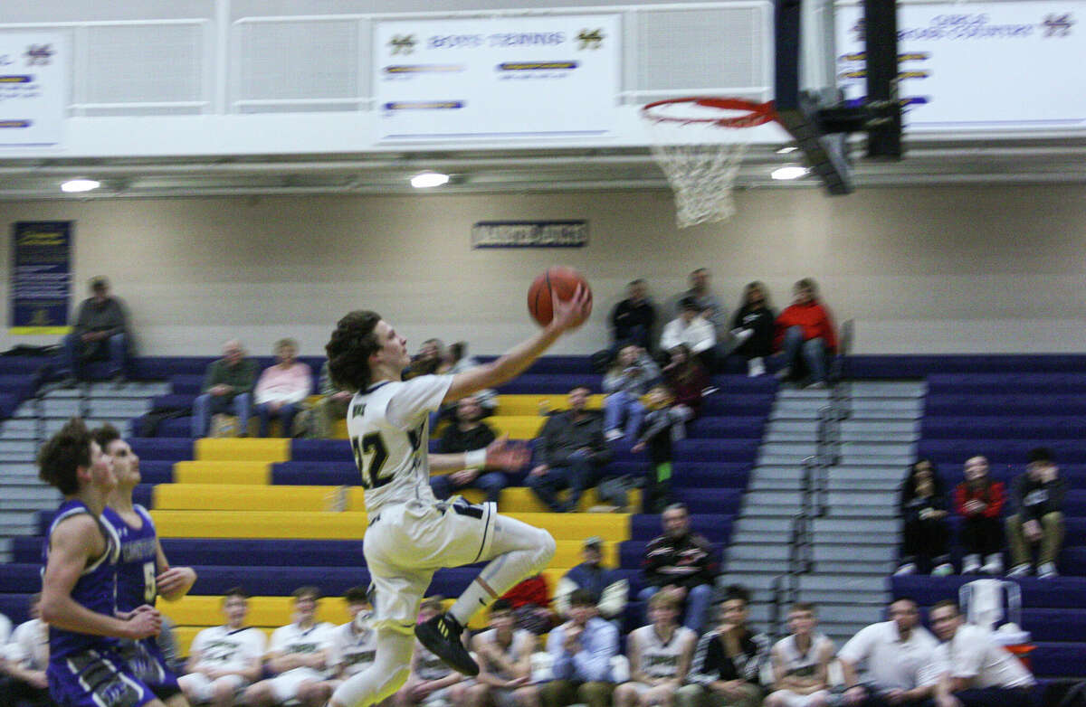Manistee senior Ethan Edmondson goes up for a layup against Montague on Jan. 17 at Manistee High School. 