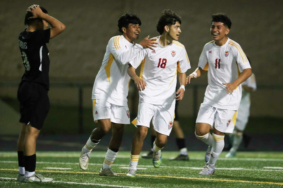 Caney Creek’s Emmanuel Gloria (18) celebrates after scoring a goal in the first half of a District 13-6A high school soccer match at Buddy Moorhead Stadium, Tuesday, Jan. 17, 2022, in Conroe.