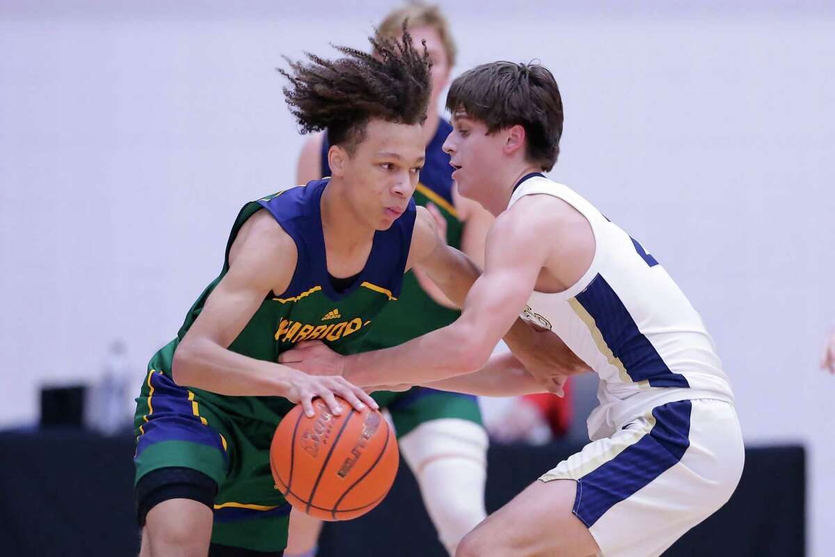 The Woodlands Christian’s Tres Luzey, left, scored 18 points to help the fourth-ranked Eagles knock off No. 1 Second Baptist on the road in a key TAPPS District 5-5A game on Tuesday.