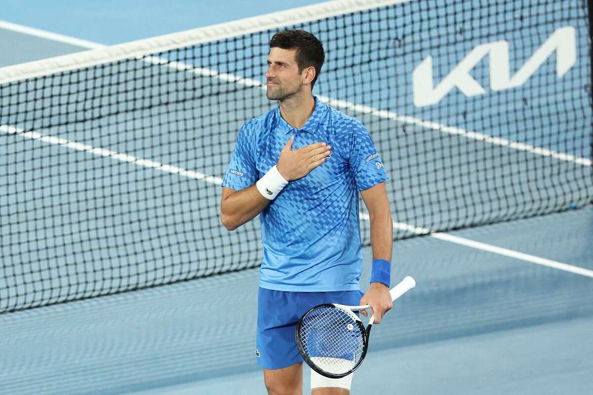 Novak Djokovic acknowledges the crowd’s support after beating Roberto Carballes Baena on Tuesday in his first Australian Open match in two years. He was denied entry last year.