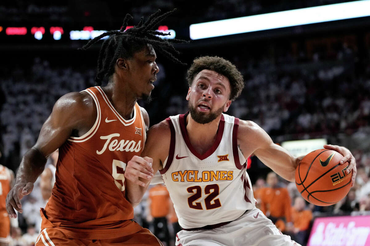 Iowa State guard Gabe Kalscheur is fouled by Texas guard Marcus Carr while driving to the basket during the second half Tuesday night's game in Ames, Iowa. Kalscheur scored 16 points to help lead the Cyclones to a 78-67 win over the Longhorns.