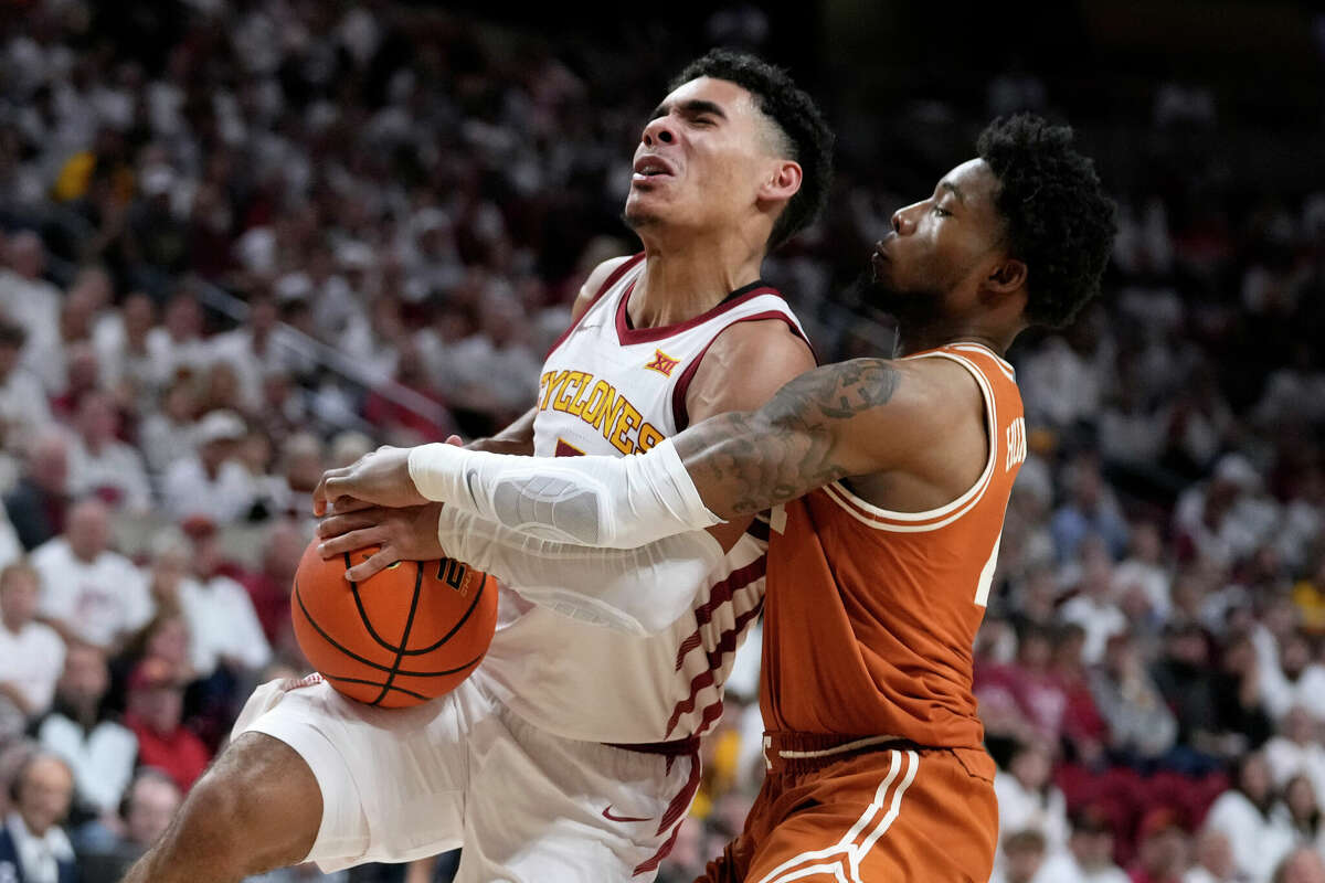 Texas guard Tyrese Hunter tries to steal the ball from Iowa State guard Tamin Lipsey during the second half of Tuesday night's game in Ames, Iowa.