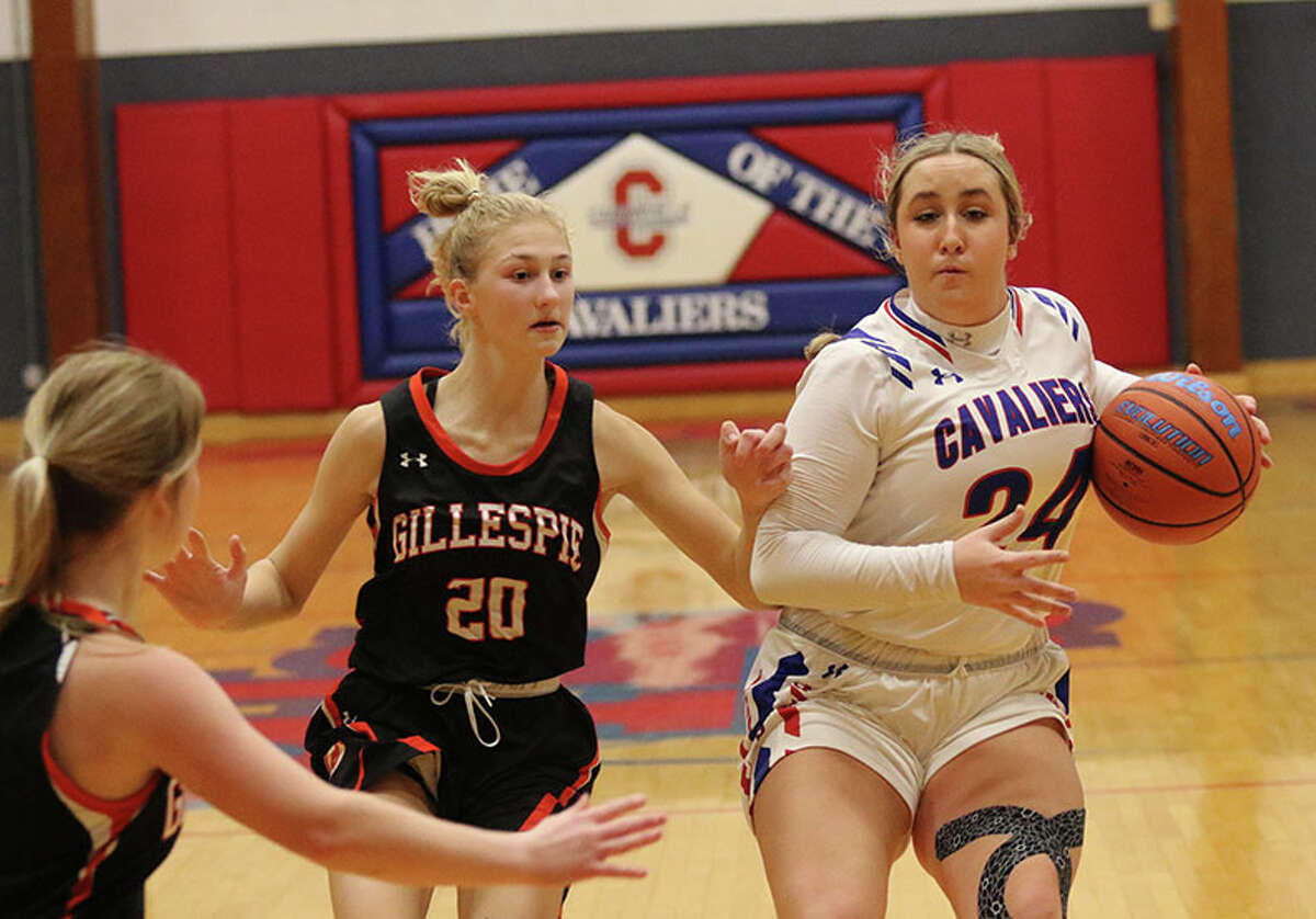 Carlinville's Isabella Tiburzi (right) handles the ball against Gillespie's Mia Brawner (20) in a Cavaliers' win at the Carlinville Tourney on Dec. 29. On Tuesday, Brawner scored 14 points to  lead Gillespie to a win over Carlinville in the semifinals of the Macoupin County Tournament in Bunker Hill.
