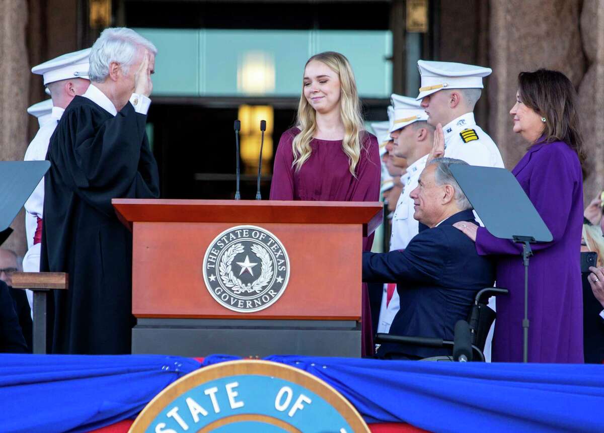 Texas Governor Greg Abbott, right, takes the oath of office Tuesday, Jan. 17, 2023 on the north steps of the Capitol in Austin from Texas Supreme Court Chief Justice Nathan L. Hecht.