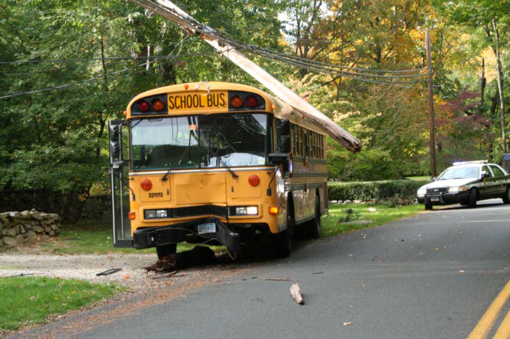 Kids, driver OK after school bus snaps utility pole