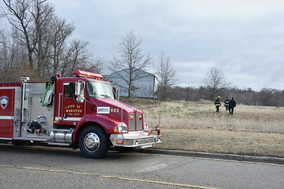 Members of the Manistee City Fire Department and Manistee City Police Department could be seen near the corner of Monroe Street and Fifth Avenue after a fire was extinguished in a pole barn in Manistee.