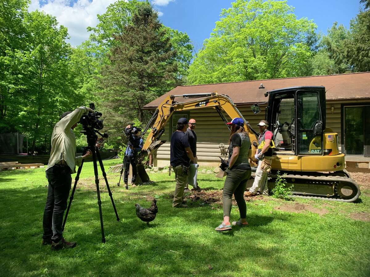 Construction underway as the crew films "In With the Old" at the Philpott residents in Weston, Conn. 