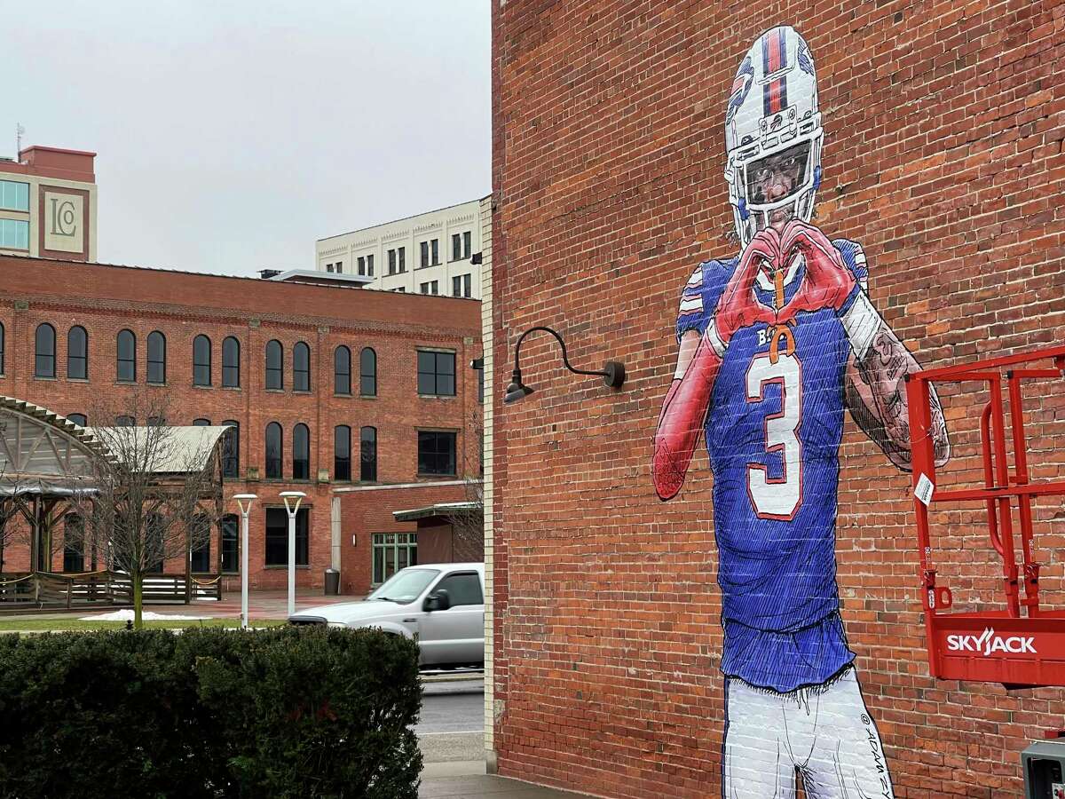 A mural by artist Adam Zyglis of Buffalo Bills player Damar Hamlin, who is recovering after going into cardiac arrest during a game Jan. 2, covers the outside of a building in Buffalo, N.Y., on Wednesday, Jan. 18, 2023.