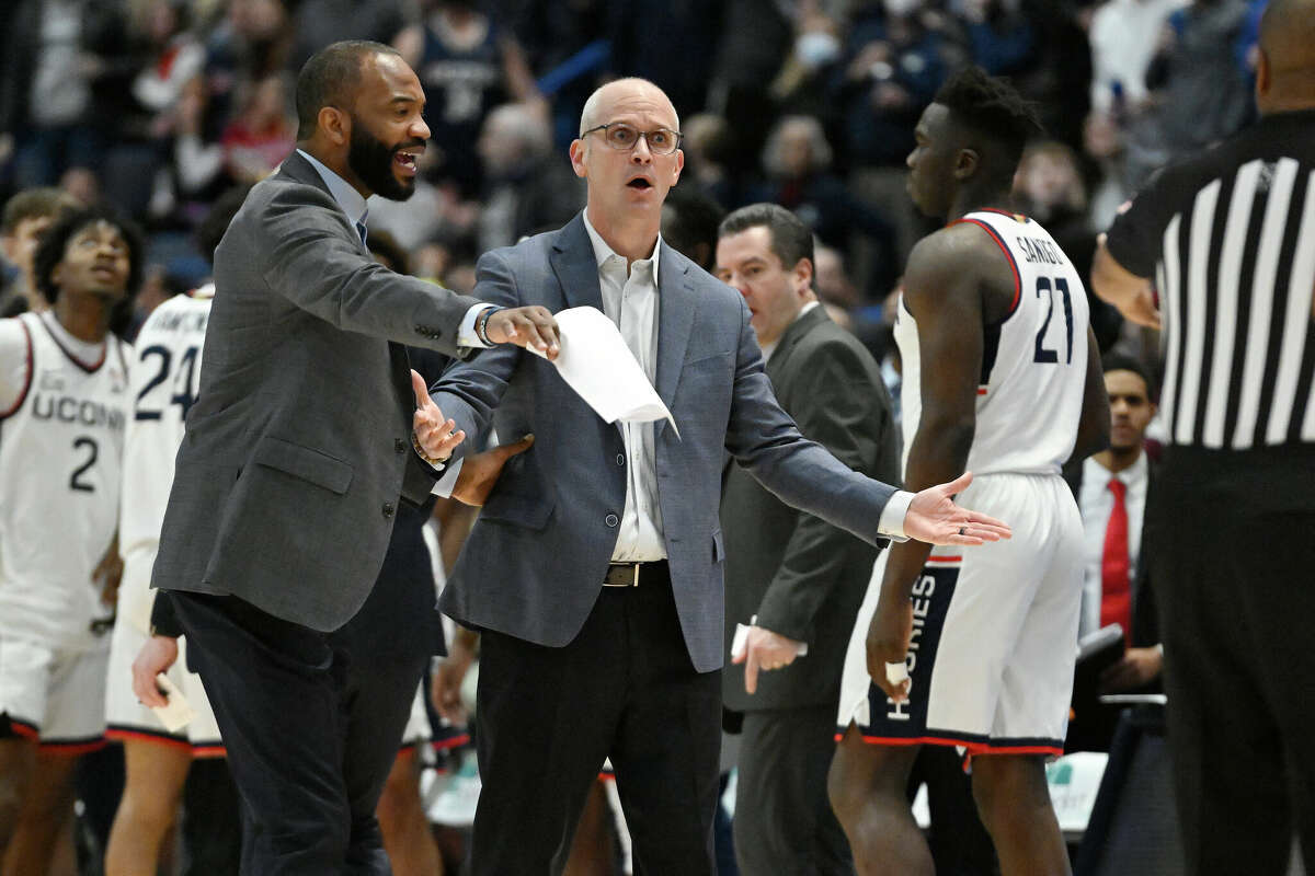 UConn head coach Dan Hurley, center, reacts with Associate Head Coach Kimani Young in the first half of an NCAA college basketball game against St. John's, Sunday, Jan. 15, 2023, in Hartford, Conn. (AP Photo/Jessica Hill)