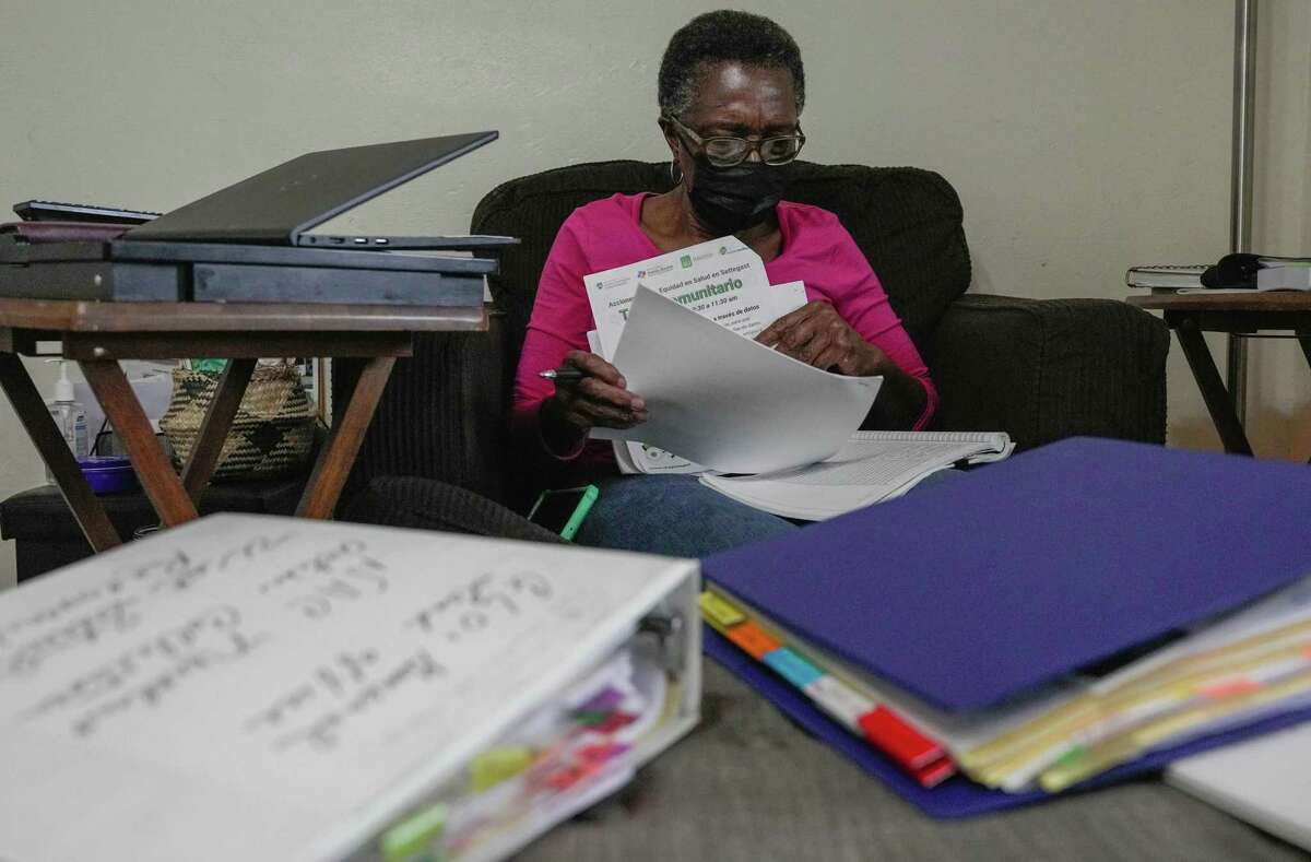 Carolyn Rivera looks through notes from community meetings for Settegast, a historically black neighborhood, which has the lowest life expectancy in Harris County on Wednesday, Jan. 18, 2023, in Houston.