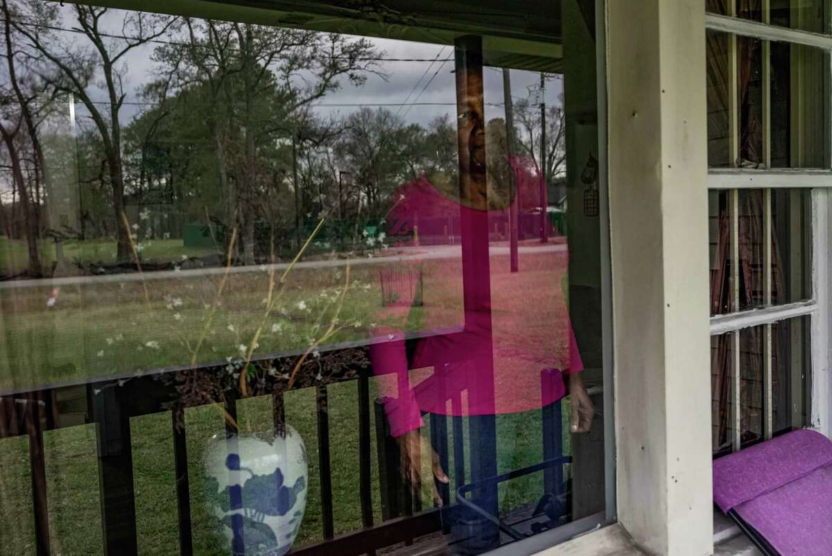Carolyn Rivera looks out the window of her home in the historically black neighborhood of Settegast, which has the lowest life expectancy in Harris County on Wednesday, Jan. 18, 2023, in Houston.