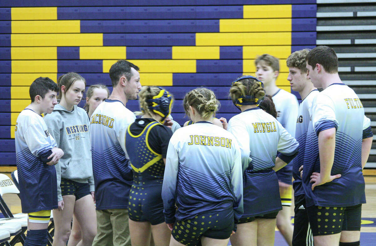 The Manistee wrestling team huddles before its meet against Ludignton and Fremont on Jan. 18 at Manistee High School. 