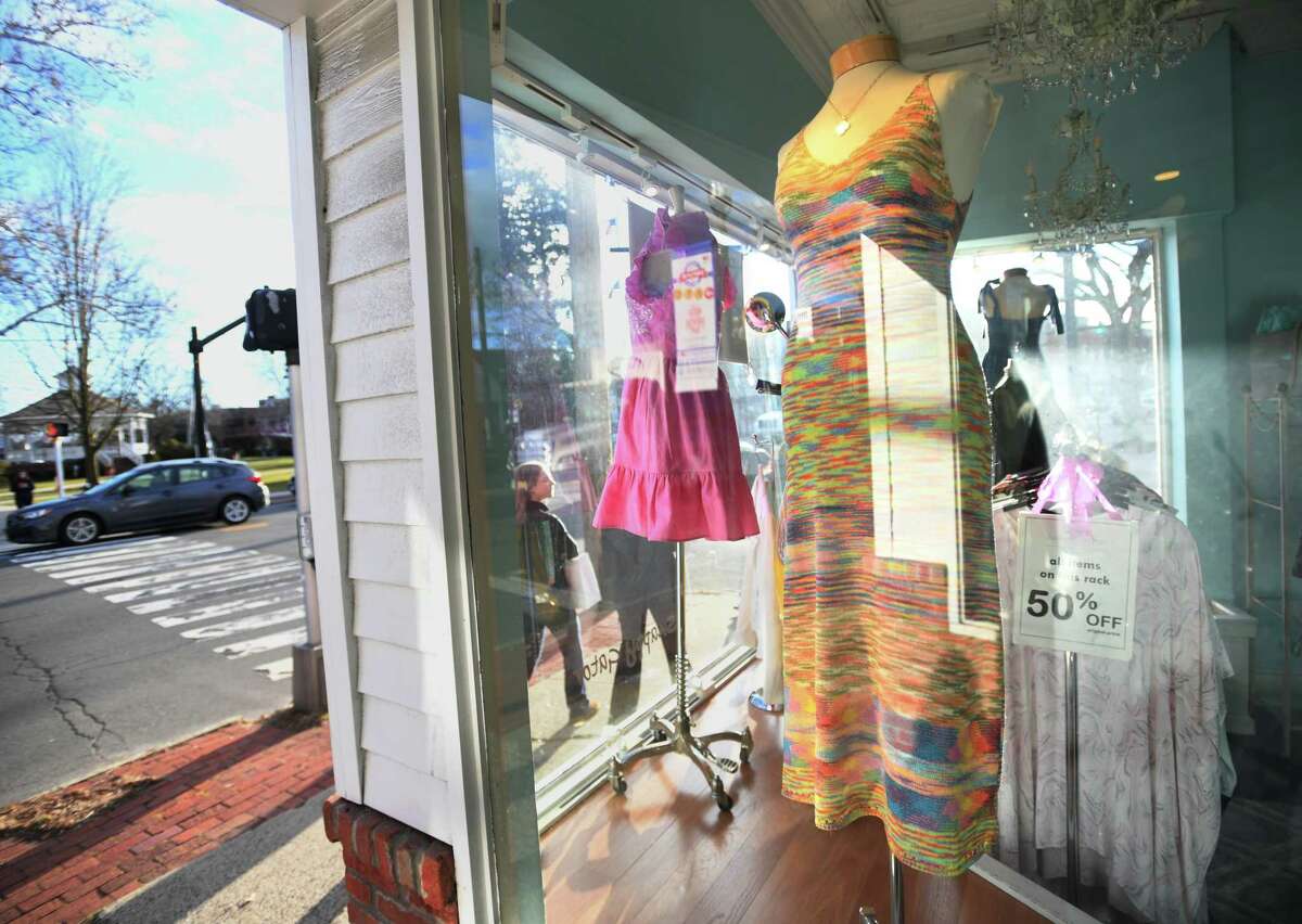 Dresses for sale in the window of Snappy Gator on the Post Road in downtown Fairfield, Conn. on Wednesday, January 18, 2023.