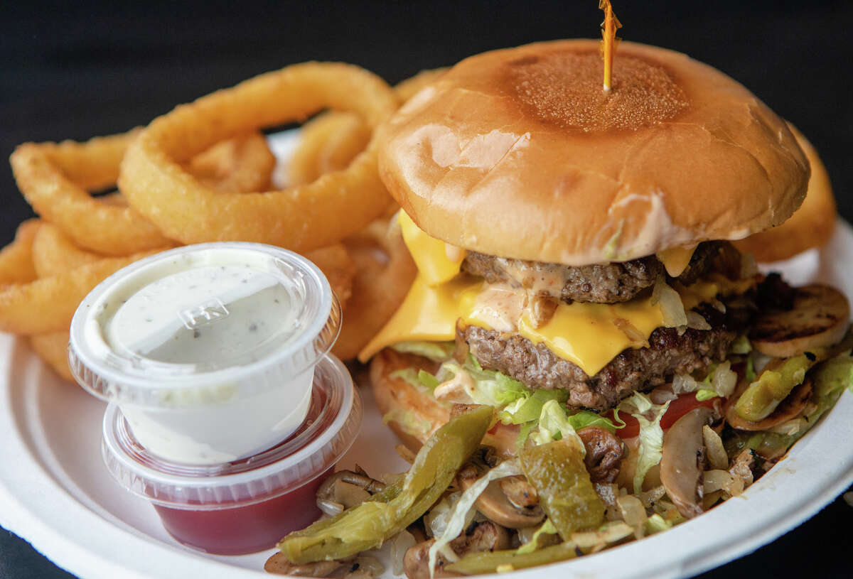 Dave's Burger at Ganim's Market in San Francisco features two patties, American cheese, mushrooms, sauteed onions and fresh grilled jalapeños.