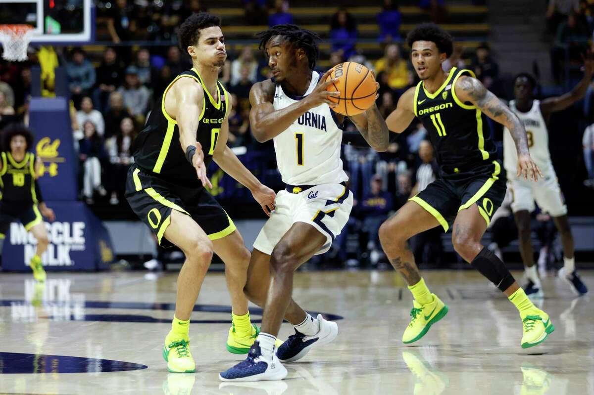 California guard Joel Brown (1) is defended by Oregon guard Will Richardson, left, and guard Rivaldo Soares during the first half of an NCAA college basketball game in Berkeley, Calif., Wednesday, Jan. 18, 2023. (AP Photo/Jed Jacobsohn)