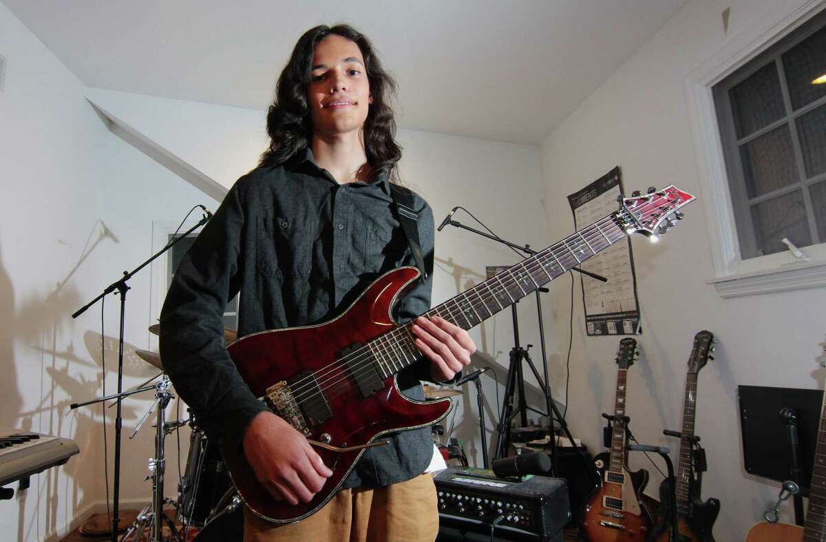 Musician Nikhil Talwalkar, 17, poses in his home studio in Darien, Conn., on Wednesday January 18, 2023. Talwalkar's solo album, Reality Drips Into the Mouth of Indifference, landed on Spin Magazine's top ten metal albums of the year alongside genre legends like Ozzy Osbourne.