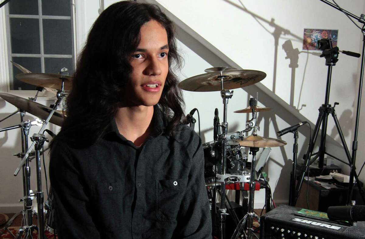 Musician Nikhil Talwalkar, 17, poses in his home studio in Darien, Conn., on Wednesday January 18, 2023. Talwalkar's solo album, Reality Drips Into the Mouth of Indifference, landed on Spin Magazine's top ten metal albums of the year alongside genre legends like Ozzy Osbourne.