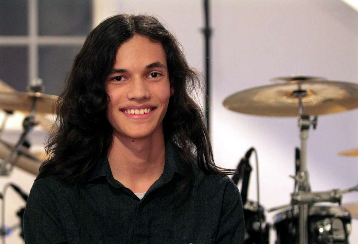 Musician Nikhil Talwalkar, 17, poses in his home studio in Darien, Conn., on Wednesday January 18, 2023. Talwalkar's solo album, Reality Drips Into the Mouth of Indifference, landed on Spin Magazine's top ten metal albums of the year alongside genre legends like Ozzy Osbourne.