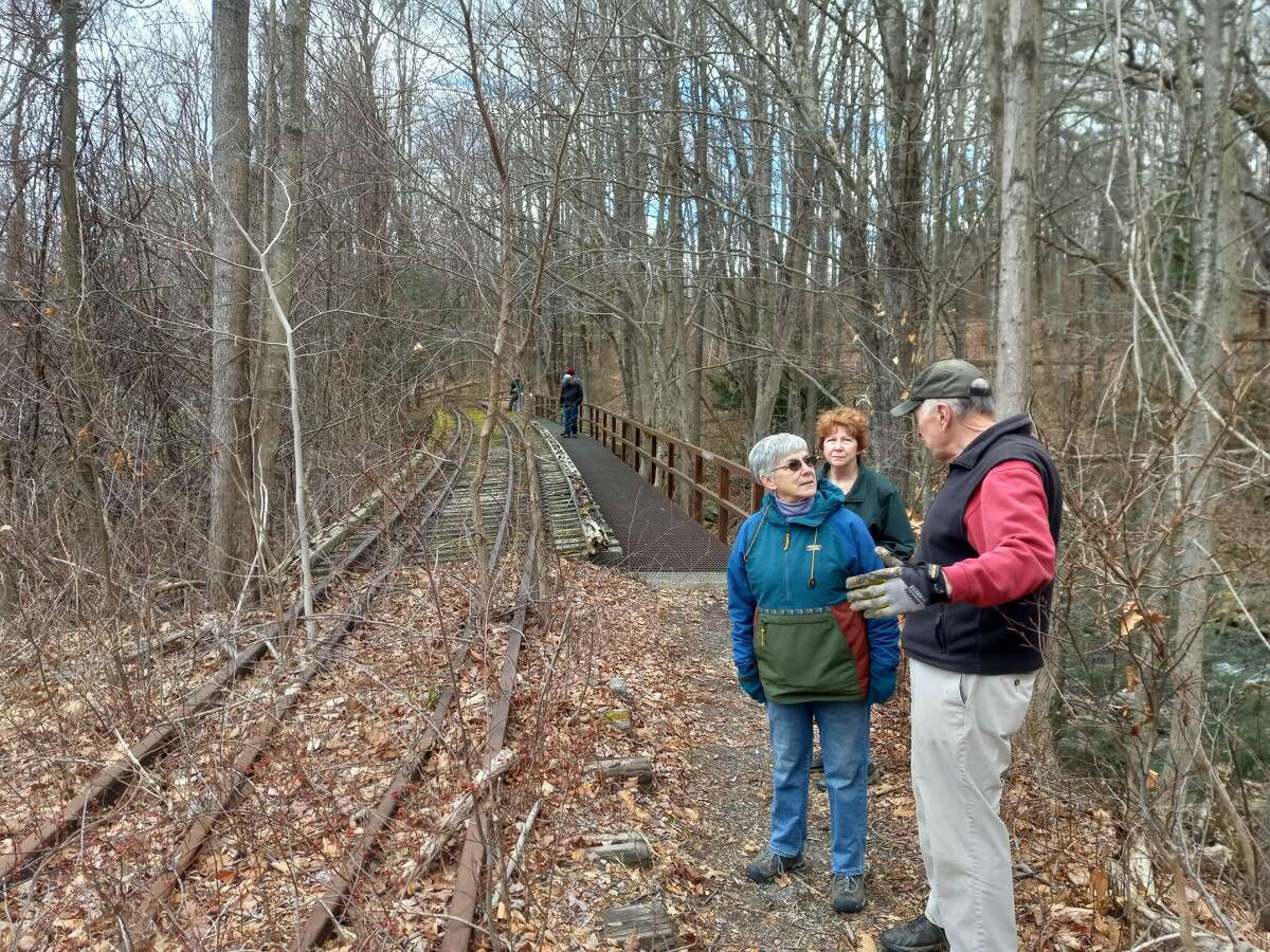 Members of the Torrington Trails Network walk a portion of trail that will eventually become part of the Sue Grossman Still River Greenway. The trail is behind Planet Fitness and Ocean State Job Lots in a shopping center off Main Street.