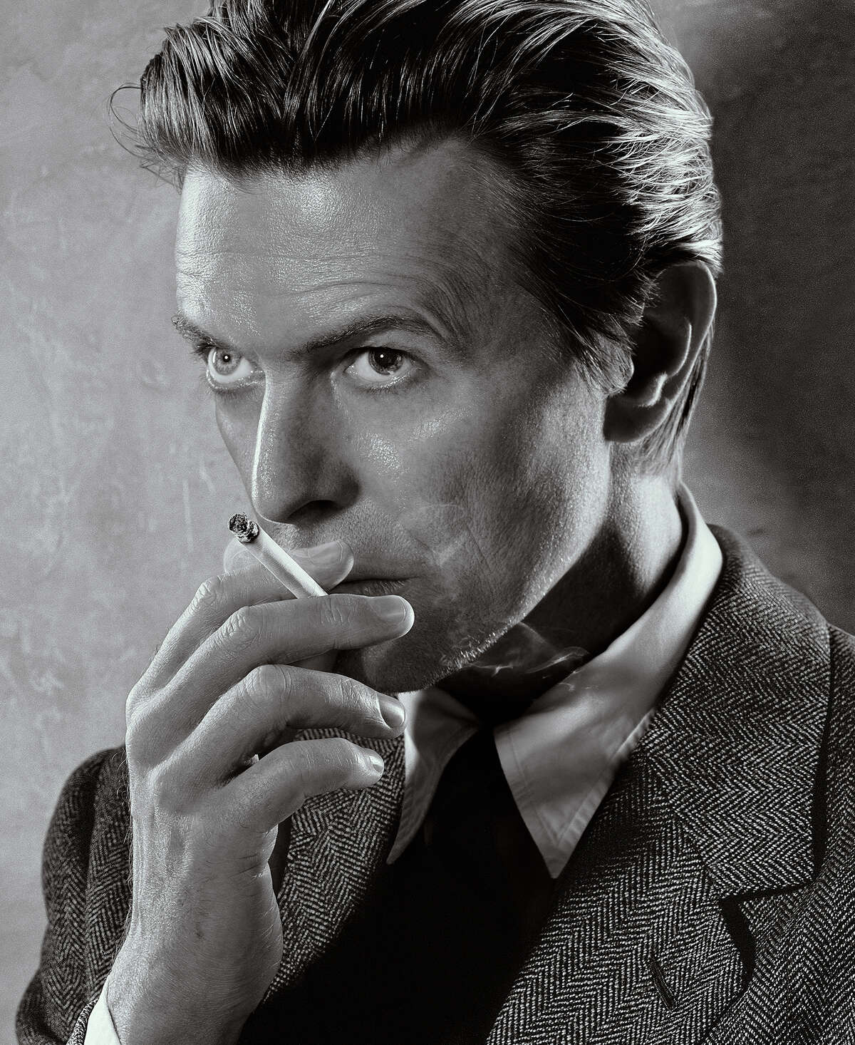 “David Bowie, Smoking, Black and White,” photographed in 2001 by Markus Klinko Printed by Weldon Color Lab on Fujicolor Chrystal Archive Digital Pearl Paper, 24x20 inches. Included in “Klinko,” a 2023 show at Nicole Longnecker Gallery in Houston, Texas, one of only two galleries in the world showing the exhibition. NOTE: ONE-TIME USE ONLY.