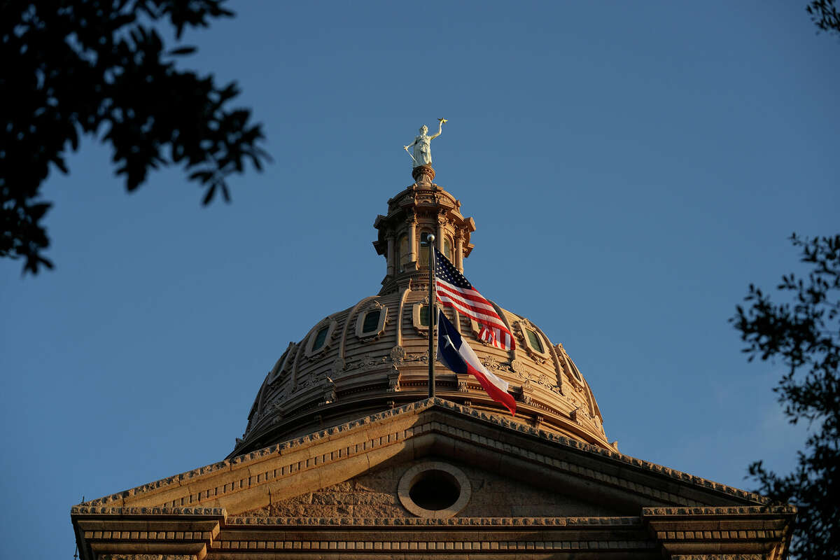 The U.S. and Texas flags fly over the Texas Capitol on the first day of the 88th Texas Legislative Session in Austin, Texas, Tuesday, Jan. 10, 2023. (AP Photo/Eric Gay)