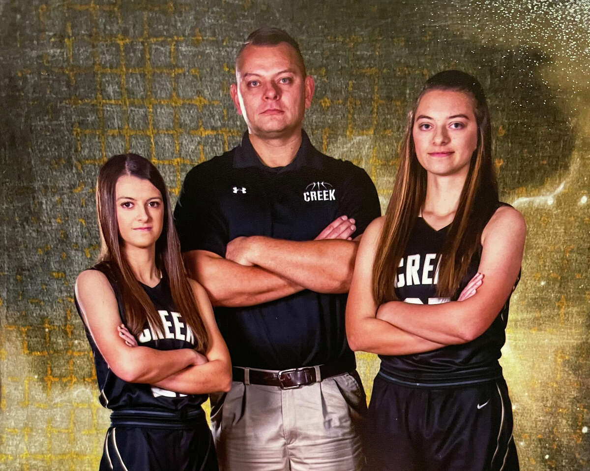 Bullock Creek girls' basketball coach Jeff Kozak poses with his daughters and current Lancers Emily (right) and Gloria.
