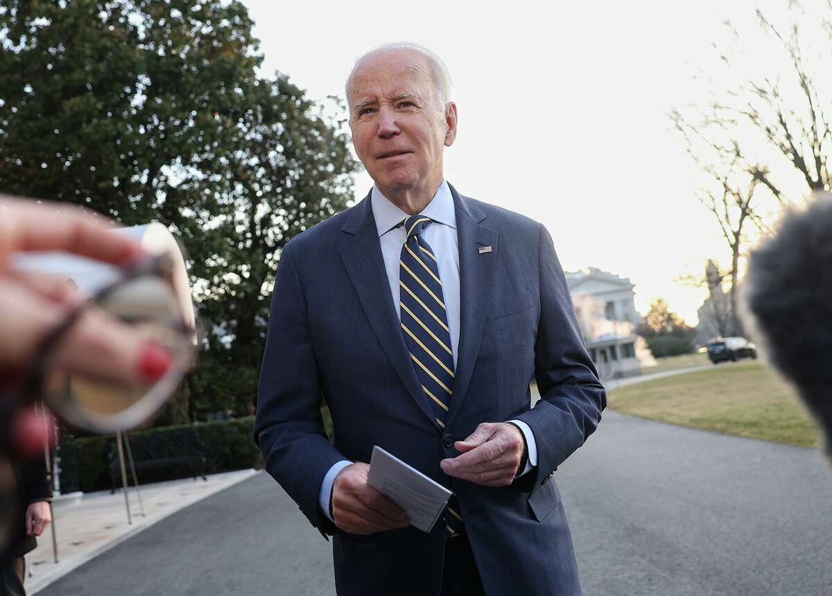 President Joe Biden meets with reporters outside the White House.