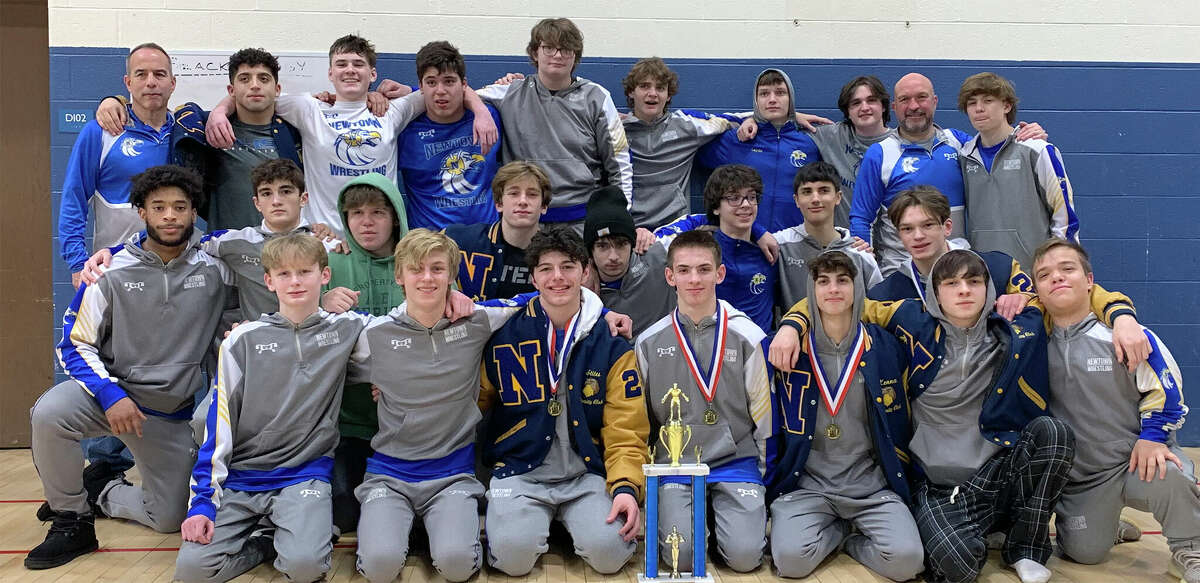 The Newtown wrestlers pose for a team photo after winning the Greater Hartford Open in West Hartford on Saturday, Jan. 14, 2023.