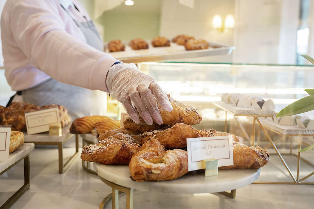 Daniela Fabre adjusting pastries at Marvel Cake in Campbell CA, Jan. 13, 2023