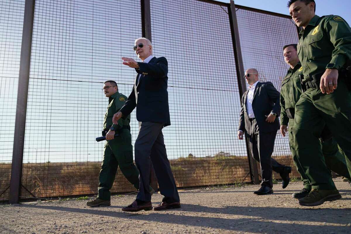 FILE - President Joe Biden walks along a stretch of the U.S.-Mexico border in El Paso Texas, Jan. 8, 2023.