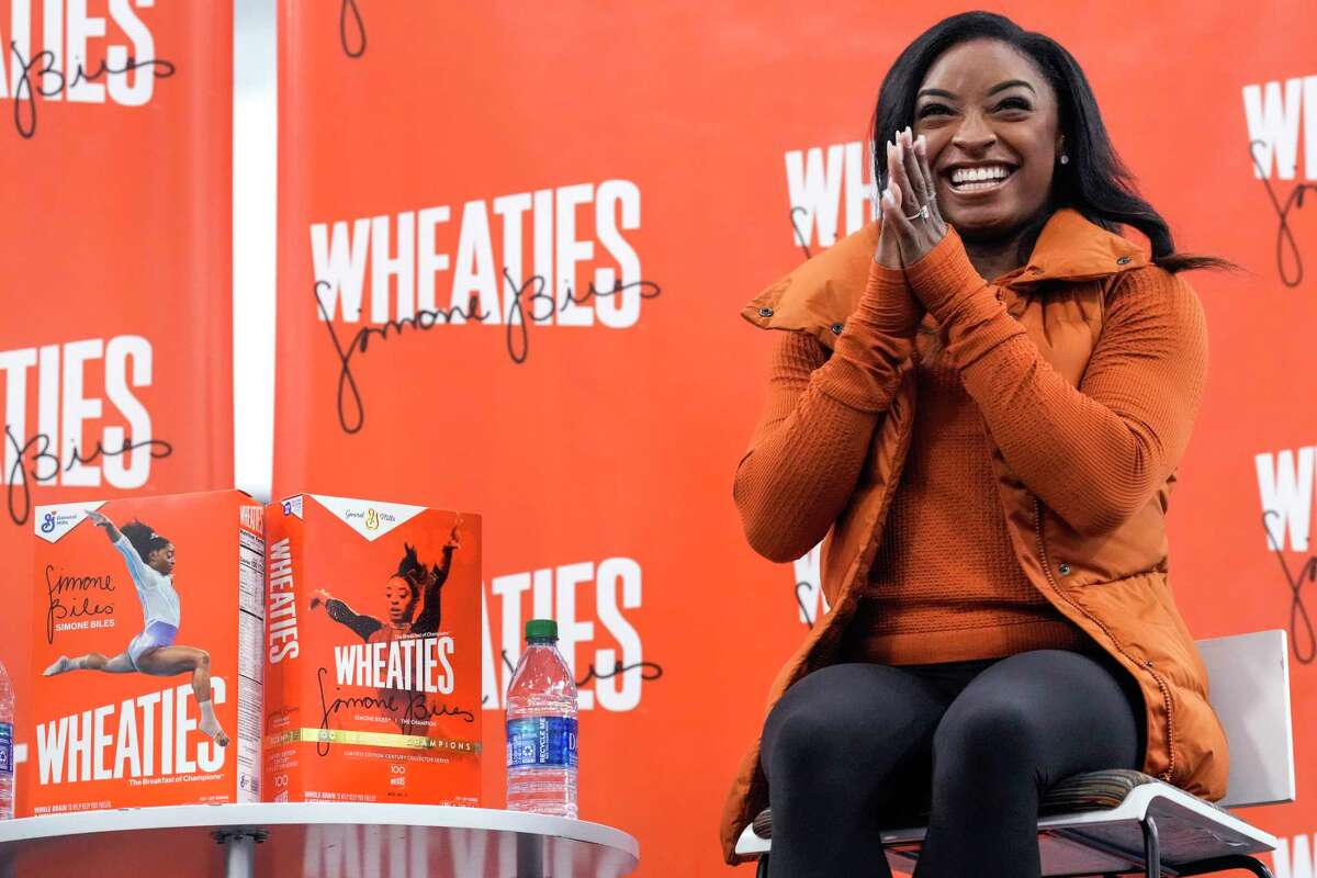 Olympic gold medalist Simone Biles reacts to a question as she participates in a question and answer session with kids from Friends of the Children as she revealed her second Wheaties limited-edition box cover on Thursday, Jan. 19, 2023 in Spring. Friends of the Children is a national nonprofit committed to ongoing mentorship of youth, which will open a chapter in the Houston area this year.