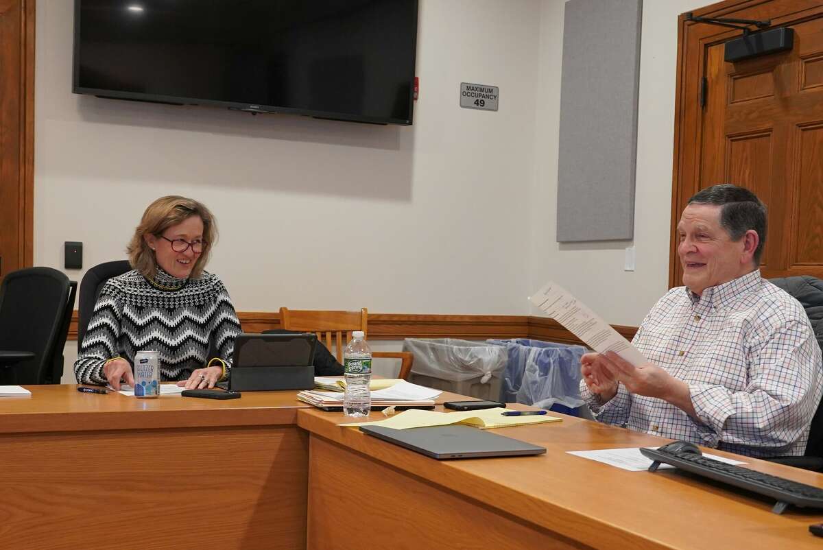 Councilman Kimberly Norton shares a laugh with Councilman Tom Butterworth at a meeting in New Canaan Town Hall in January.