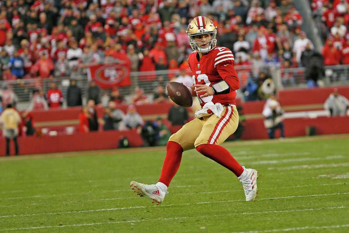 San Francisco 49ers quarterback Brock Purdy (13) scrambles in the fourth quarter of an NFL wild-card round playoff game at Levi’s Stadium in Santa Clara, Calif., Saturday, Jan. 14, 2023.