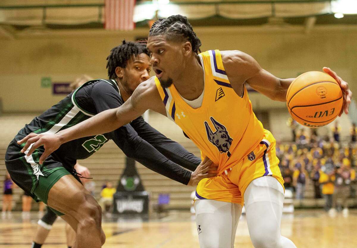 UAlbany's Gerald Drumgoole Jr. pushes past Binghamton's Christian Hinckson during a game at the McDonough Sports Complex in Troy, NY on Thursday, January 19, 2023.  (Jenn March, Special to the Times Union)