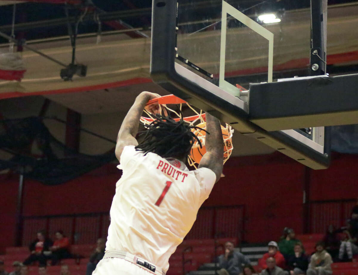 SIUE's DeeJuan Pruitt dunks against Morehead State on Thursday inside First Community Arena. Pruitt scored 11 points and grabbed nine rebounds in the Cougars' 67-58 loss.