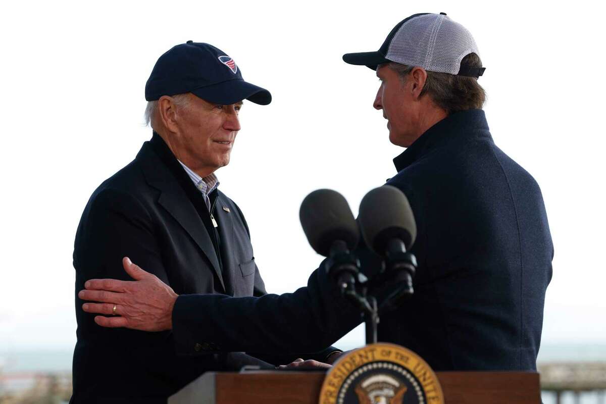President Joe Biden greets California Governor Gavin Newsom before delivering marks after taking a tour of the damage done to Seacliff Pier and Seacliff State Beach in Aptos, Calif. Thursday, Jan. 19, 2023 while on a tour to assess damage caused by a series of major storms.