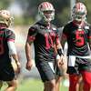 San Francisco 49ers’ Jimmy Garoppolo (10), Trey Lance (5) and Brock Purdy during practice in Santa Clara, Calif., on Thursday, September 1, 2022.