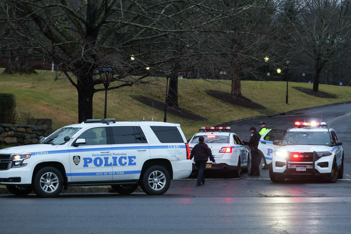 New York City Environmental Protection Police block off an area around 113 King St. in Armonk, N.Y., Friday Jan. 20, 2023, after a small plane crash the night before. Two people were killed in the crash, according to officials. 