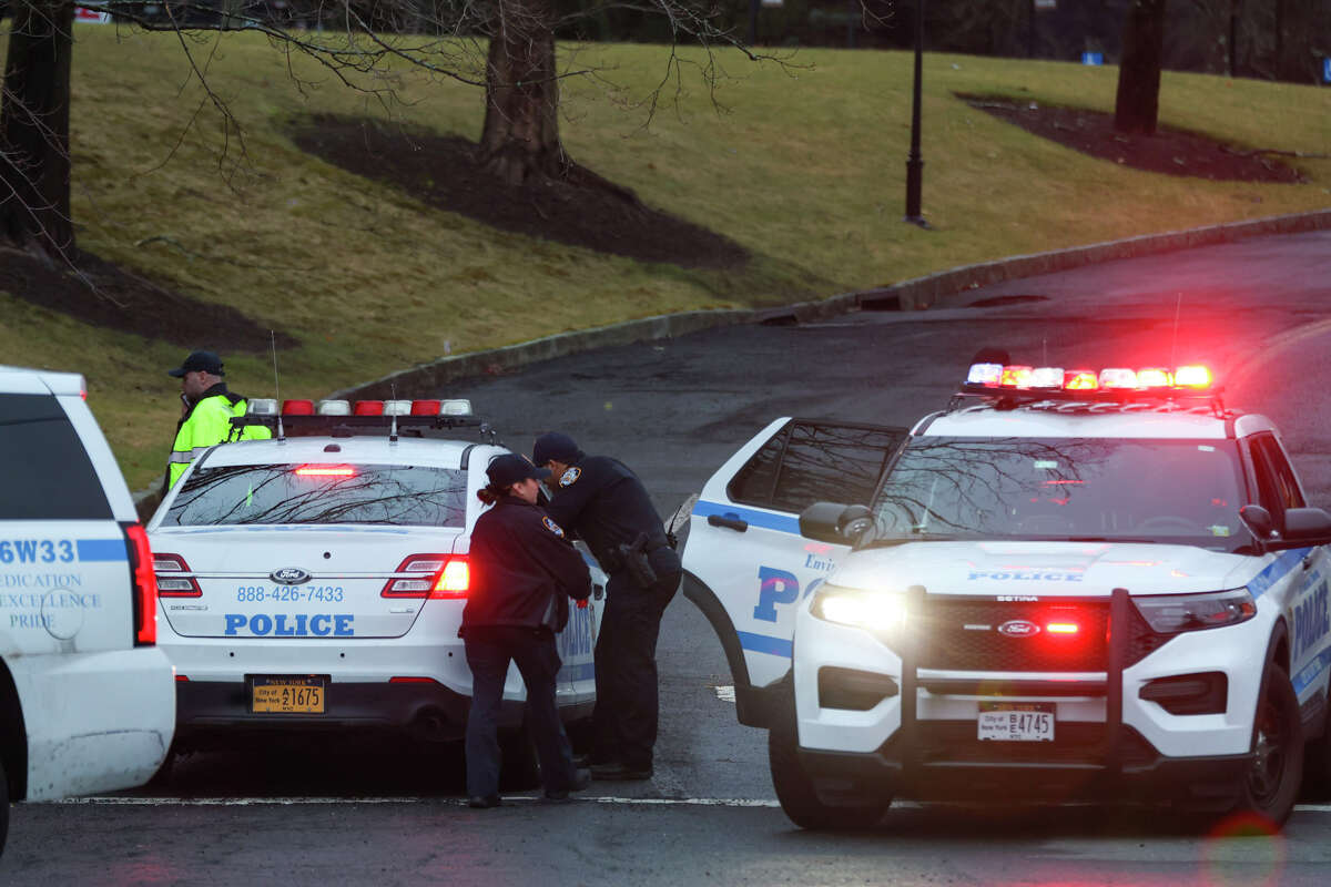 New York City Environmental Protection Police block off an area around 113 King St. in Armonk, N.Y., Friday Jan. 20, 2023, after a small plane crash the night before. Two people were killed in the crash, according to officials. 