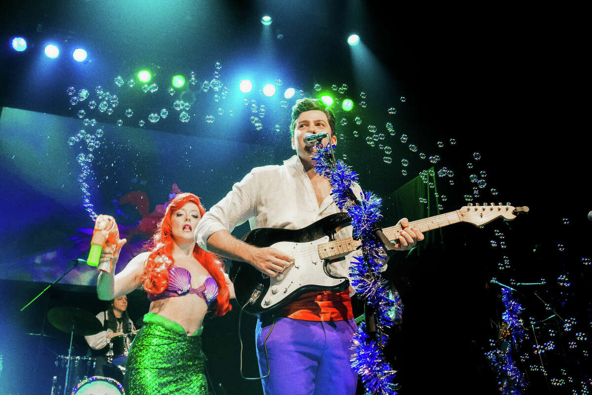 The Little Mermen include (from left) lead singer and guitarist Alexis Babini as Prince Eric from The Little Mermaid and Carly Kincannon as Ariel.