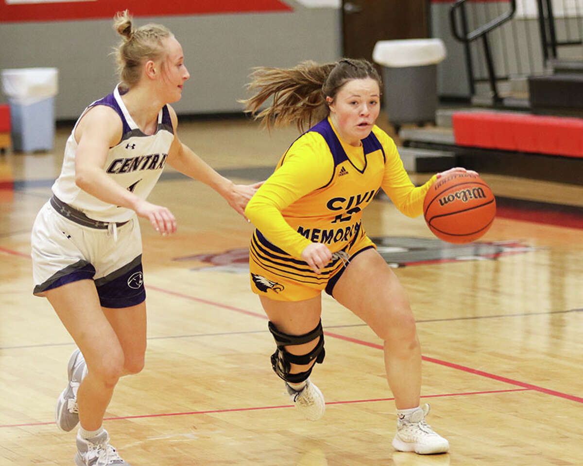 CM's Aubree Wallace drives one Breese Central's Kylie Rakers (left) in the first half  Thursday night in a fifth-place semifinal at the Highland Tournament.