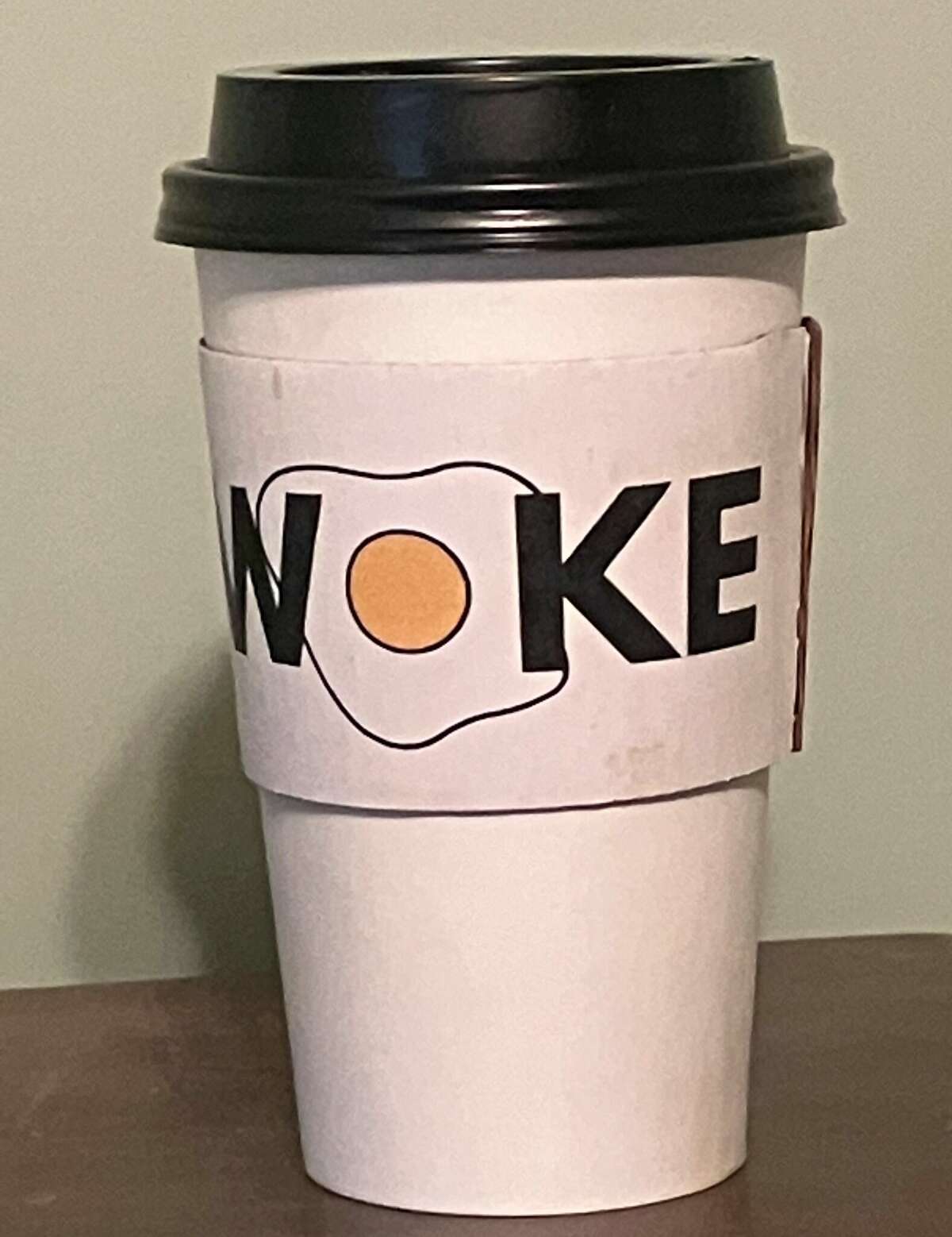 Woke Breakfast & Coffee owner Carmen Quiroga said she has spent thousands on signs and other items, including coffee sleeves with the restaurant logo, and is not changing the name.