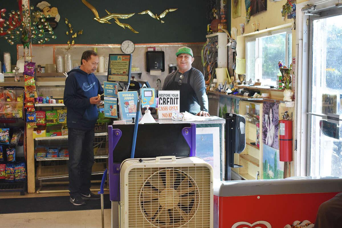 Martin Muñoz, behind the counter, talks to Hayward resident Rafael Lee, who makes a weekly pilgrimage to Prunedale Market & Deli for the renowned sandwiches and the company. 