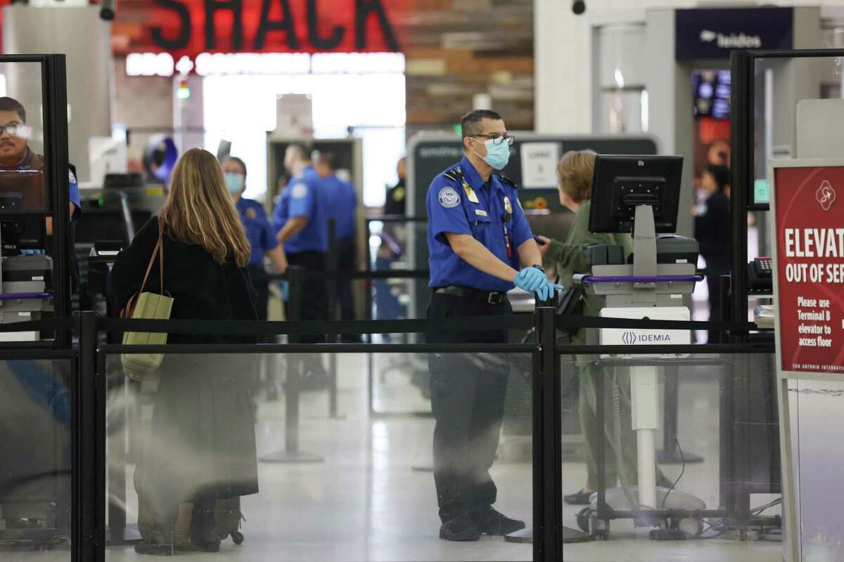 Transportation Security Administration agents screen passengers at San Antonio International Airport on Jan. 11. Last year, the TSA found a record number of firearms in carry-on bags there.