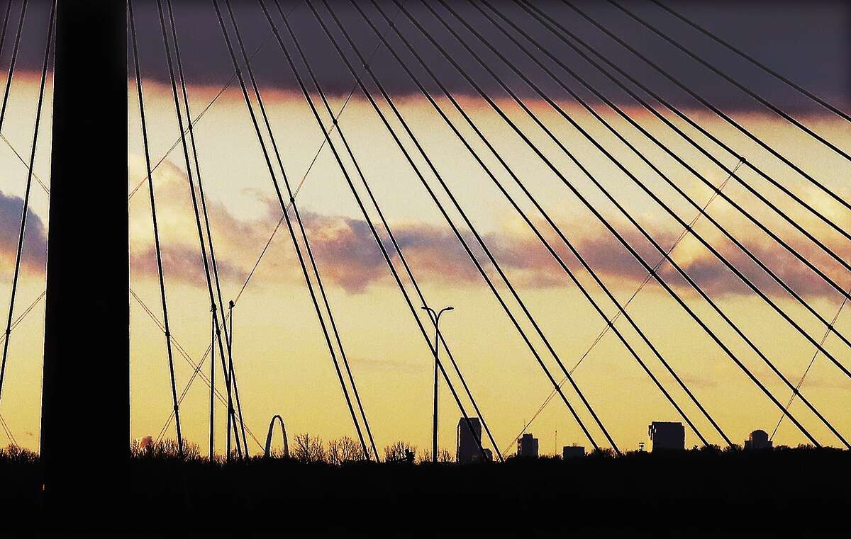 John Badman|The Telegraph It wasn't forever Thursday, more like 15 miles, but it was a clear day near the horizon for about 40 minutes allowing a view of downtown St. Louis to be seen through the cables of the Clark Bridge at 4th and Henry streets in Alton.