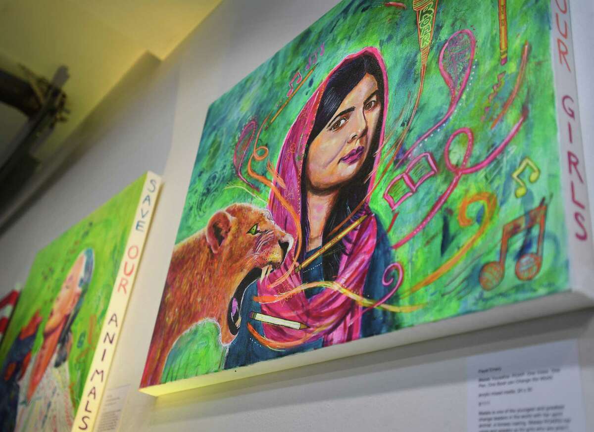 Colorful portraits of education activist Malala Yousafzai and primate researche Jane Goodall by nurse practitioner and professional artist Payal Emery, of Milford, at the Firehouse Art Gallery in Milford, Conn. on Friday, January 20, 2023.