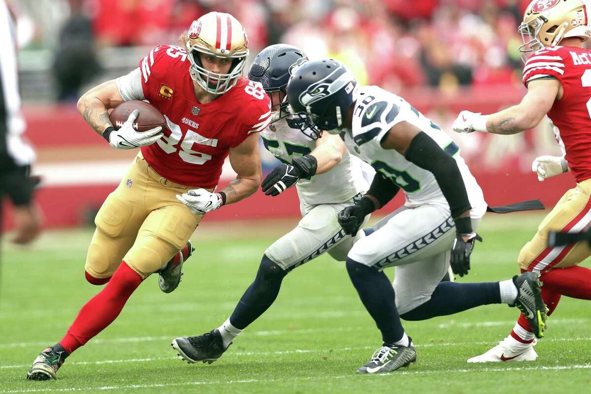 San Francisco 49ers’ George Kittle runs after a catch against Seattle Seahawks’ during NFC Wild Card Playoffs in Santa Clara, Calif., on Saturday, January 14, 2023.
