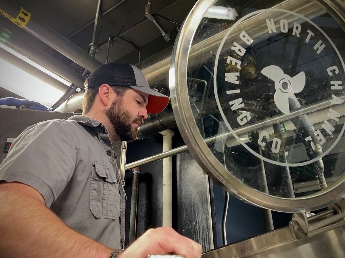 Head brewer Dan Gillespie inspects equipment at North Channel Brewing Company. The Manistee-based brewery will be featuring a variety of beers at the Ludington Brrrewfest including Mexican Lager and Irish Red. 