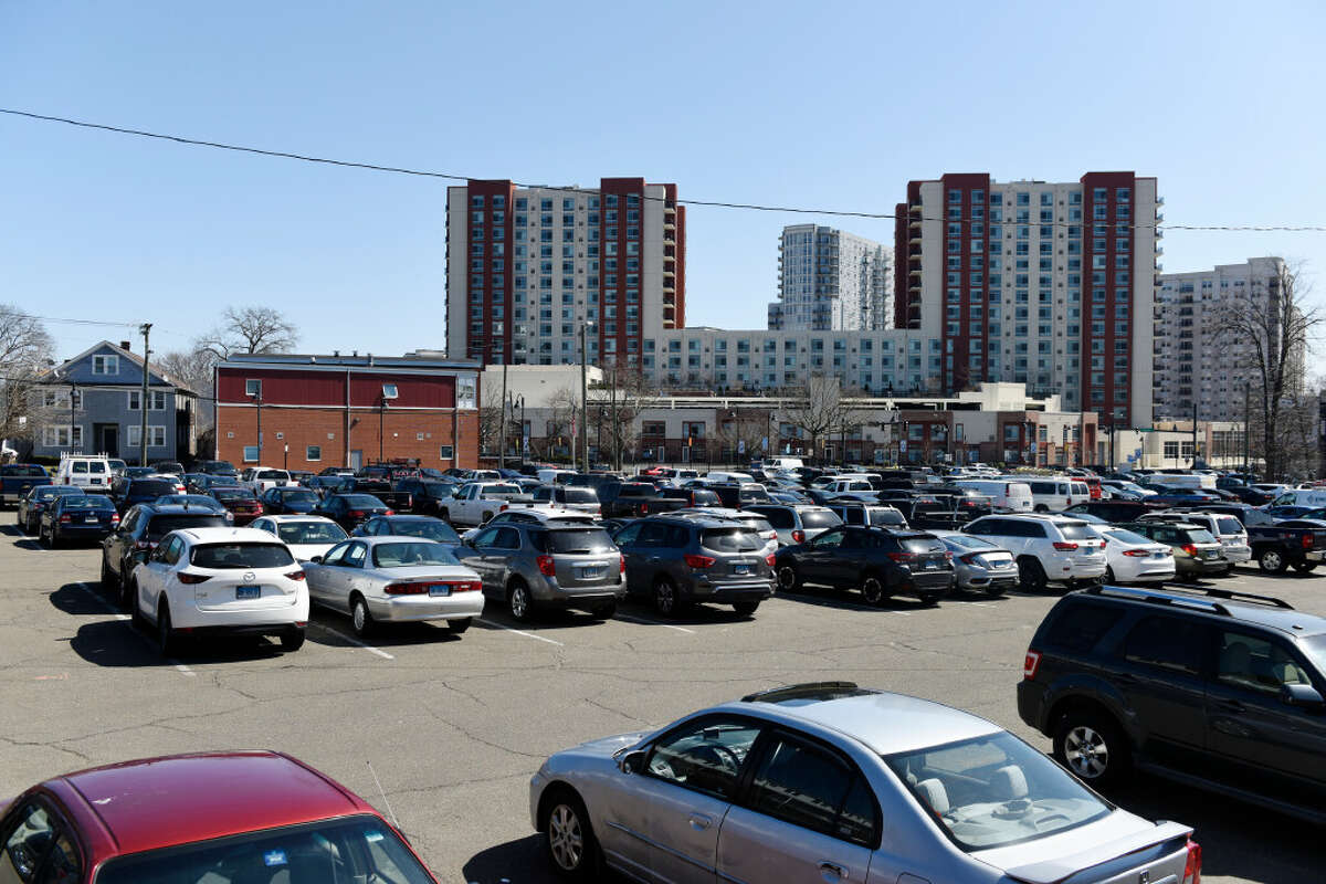 Cars are parked in a public lot on Washington Boulevard in Stamford, Conn. Monday, March 22, 2021. 