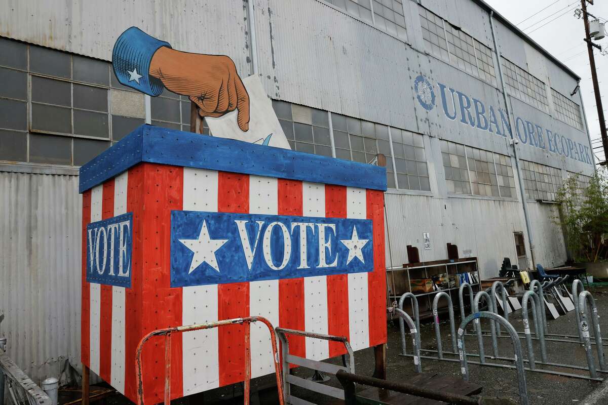 A voting booth sits outside the warehouse entrance at Urban Ore in Berkeley.